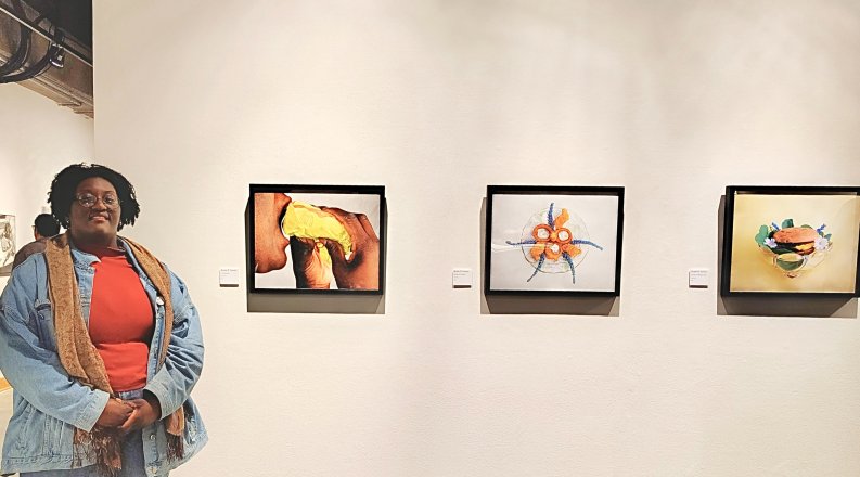 Kyani Garces poses with her photographs