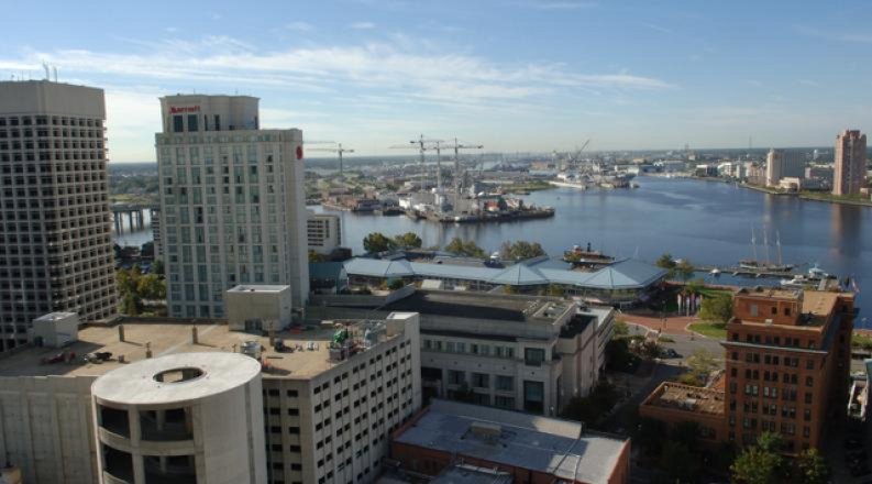 Photo of buildings overlooking the water.