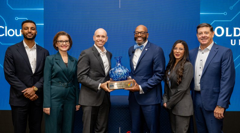 President Brian O. Hemphill, Ph.D., presents a gift to Google representatives.