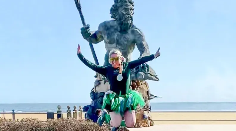 Nicole Pellegrino jumping at the finish line of the Shamrock