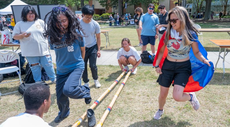 Students dancing on Kaufman Mall on ODU's campus.