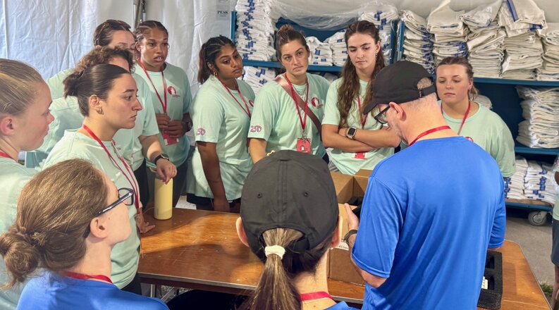 students standing around a table