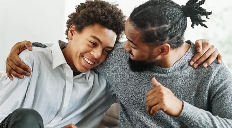 father and son hugging