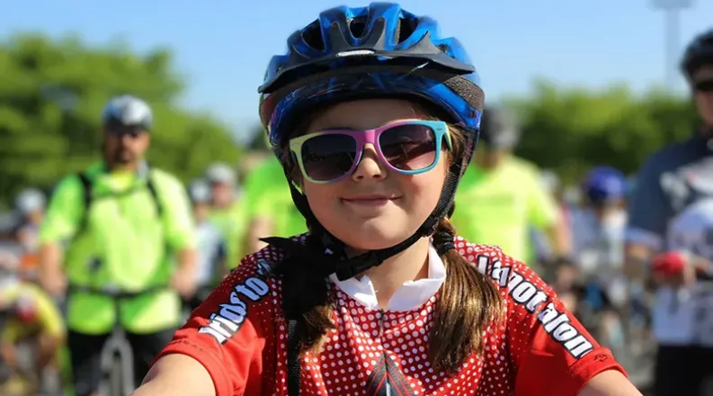 pic of girl on bike with helmet.