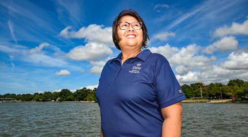 Wei Yusuf in front of water