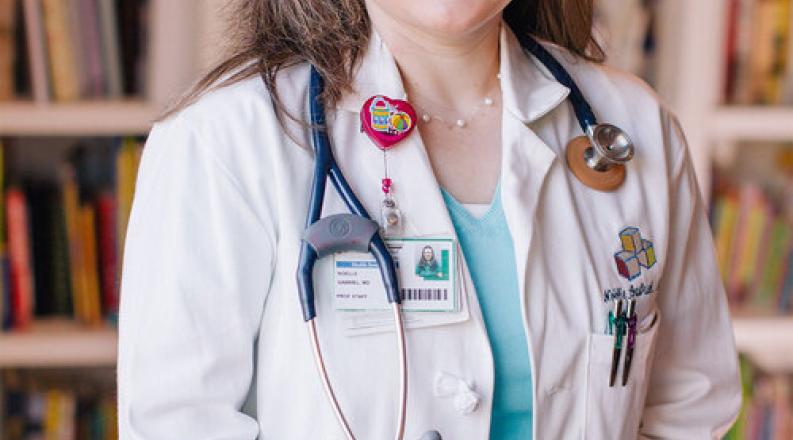 noelle-white-coat-portrait-chkd