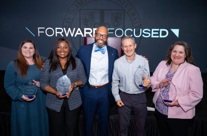 ODU President Brian O. Hemphill poses with the four Monarch Pillar Award winners