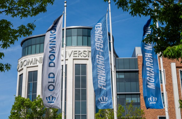 Banners outside Old Dominion University building reading "forward-focused" and "Monarch Nation" and "Old Dominion University"