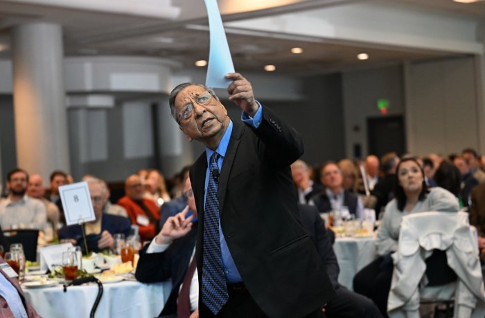 Vinod Agarwal stands in front of audience