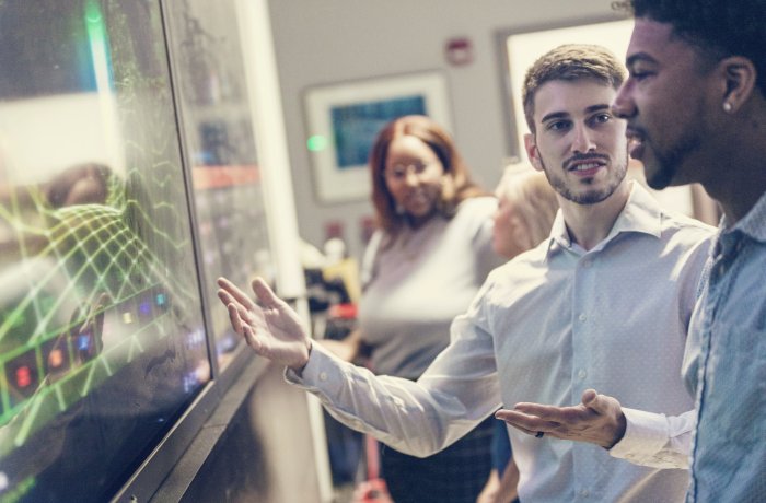 People looking at screen