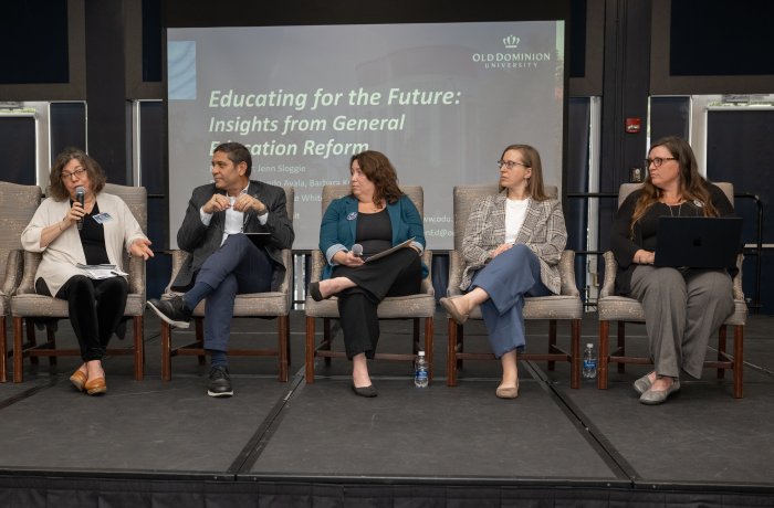 Group of people on stage for a panel