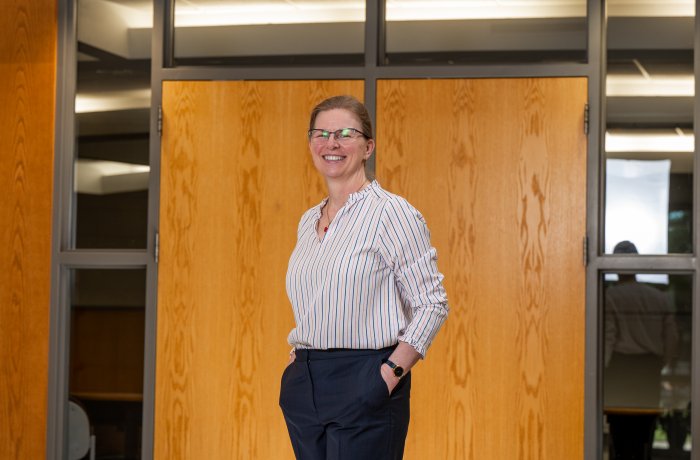 Erika Marsillac standing in front of Strome College of Business.