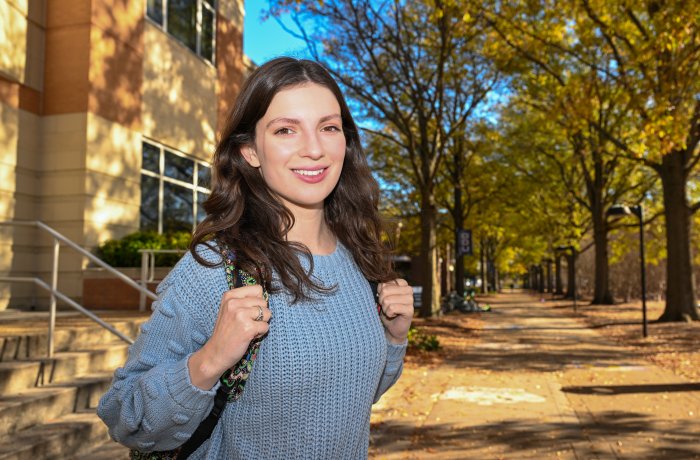 A woman stands on ODU’s campus.