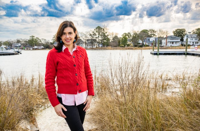 Laura Costadone in front of marshy area with house in background