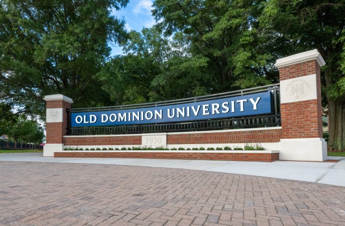 Brick pillars frame a blue and white sign welcoming visitors to Old Dominion University.