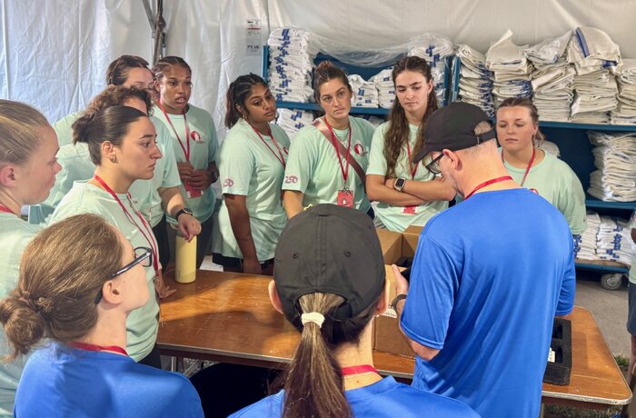 students standing around a table