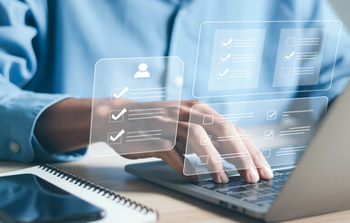 Laptop with human resources employee profile graphics