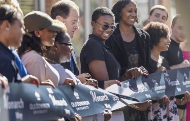 ODU students and staff cut ribbon at opening of the Monarch Way.