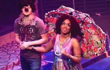 Male and female actor perform on stage during play