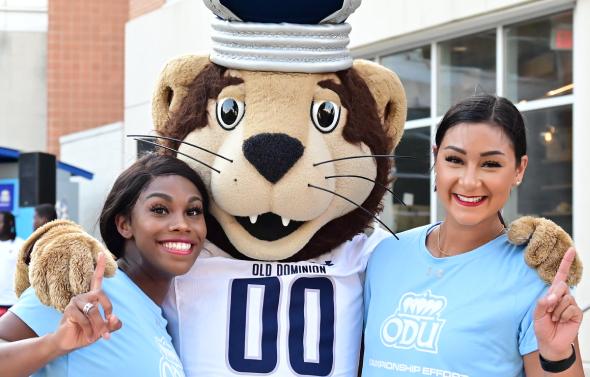 Two students with Big Blue ODU mascot