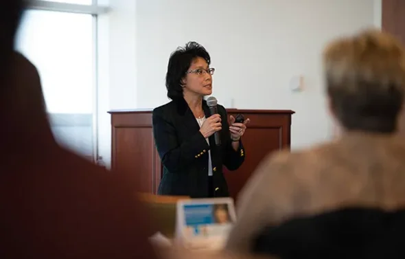 Dr. Cynthia Romero talks during a presentation to faculty.