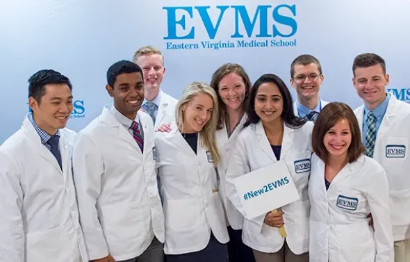 A group of new EVMS students pose for a photo during new stu