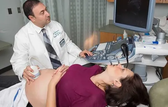 Dr. Alfred Abuhamad performs an ultrasound on a patient.
