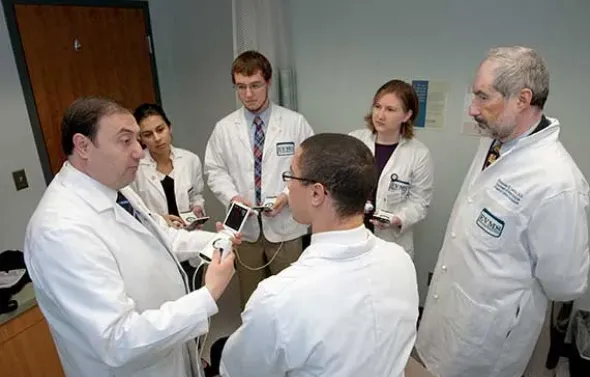 Drs. Abuhamad and Levitov with students.