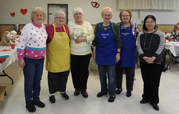 The Pythian Sisters, posing at a fundraiser, have been hosti