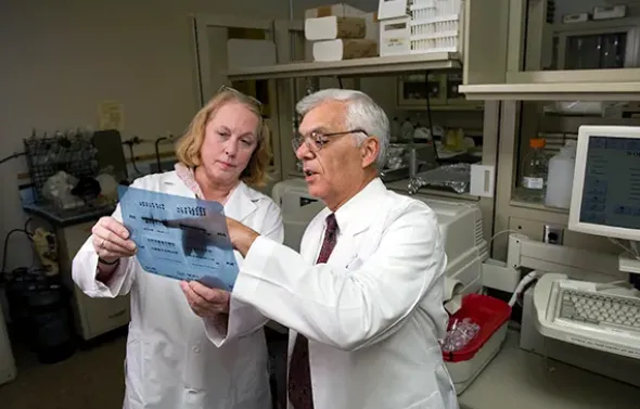 Dr. Gerald Pepe and Marcia Burch in the lab.