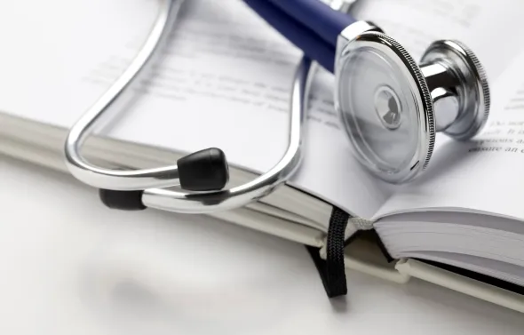 Stethoscope on book