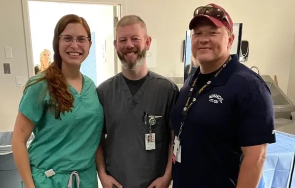 Three Emergency Medicine docs smile at the camera