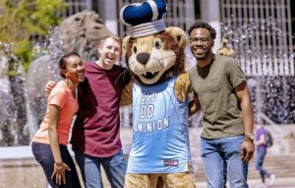 Big Blue with students in front of fountain