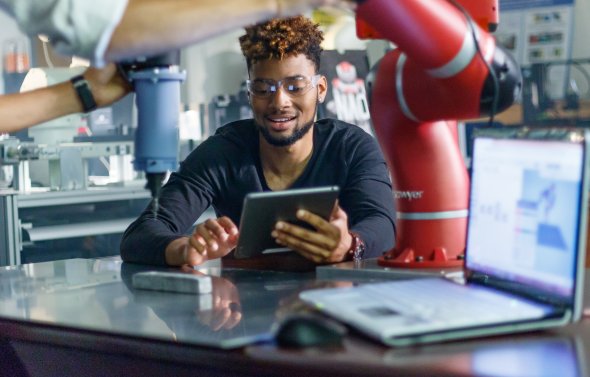 Student in lab with tablet