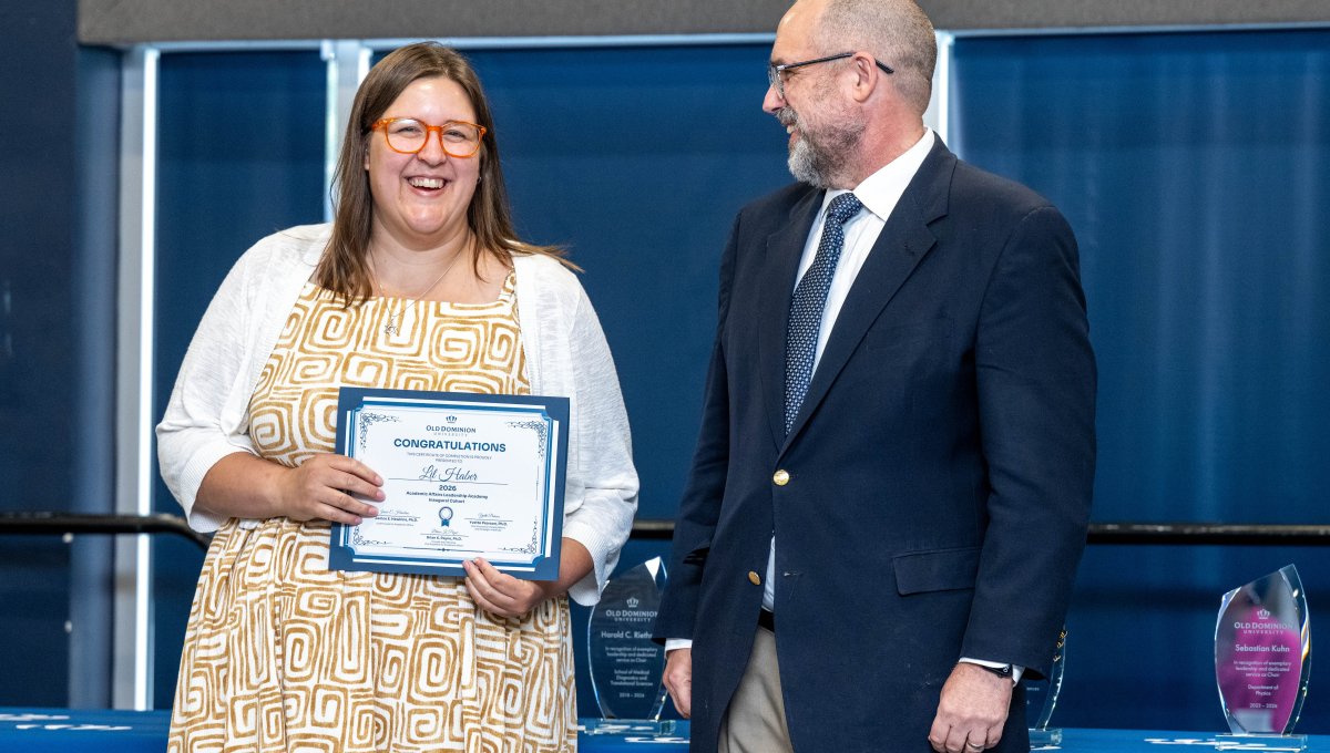 Lil Haber with Provost Payne receiving a certificate.