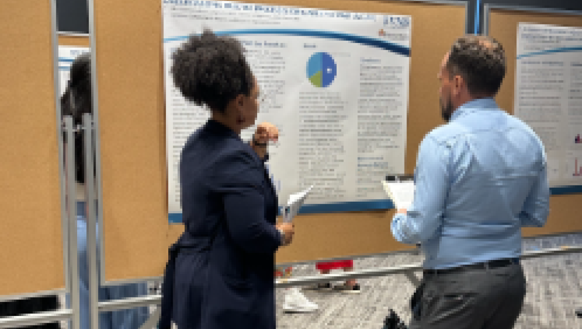 African American woman discusses with counterpart at CHCHEA 