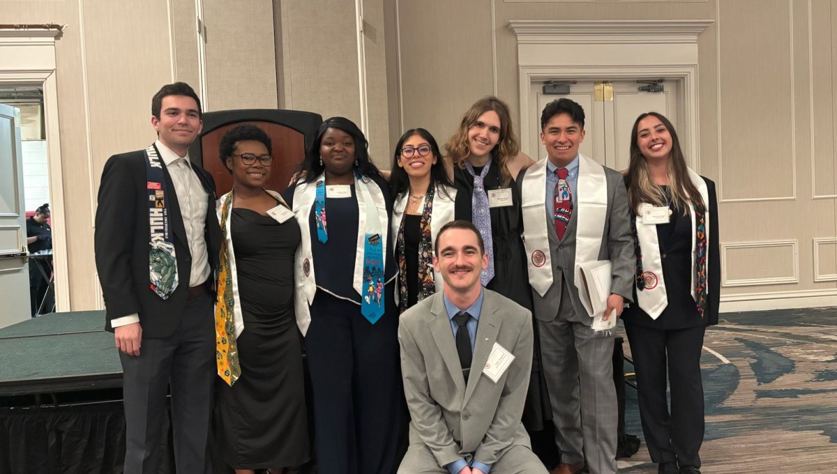students posing at a conference