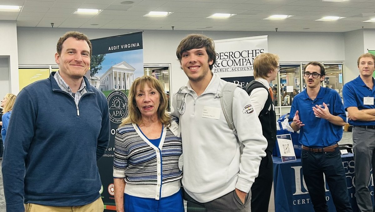 student and business at career fair