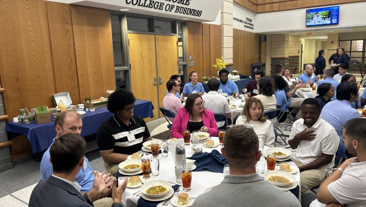 students and faculty at a luncheon
