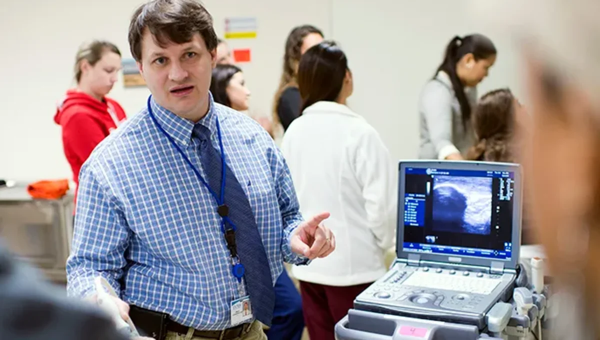 Dr. Craig Goodmurphy demonstrates ultrasound use to students