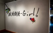 Wall with sign reading Mama Girl
