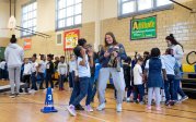 An ODU students plays games with a group of elementary school students.