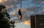 A child on a zip line.