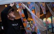 Local artist Rich Justis hangs “Ephemeral Art” before the start of this year’s Fifth Annual Public Arts Festival hosted by the Barry Art Museum.