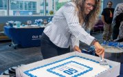 woman cuts a cake
