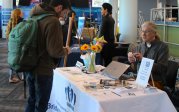 student at booth at library