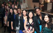 Residents smiling at graduation event. 