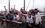 Group of residents at harbor. 