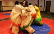 Residents in sumo suits at retreat. 