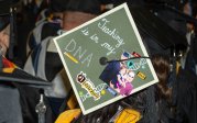 To stand out amid a sea of caps and gowns, some graduating students decorated their mortarboards with messages, images and even 3D creations. Photo Chuck Thomas/ODU